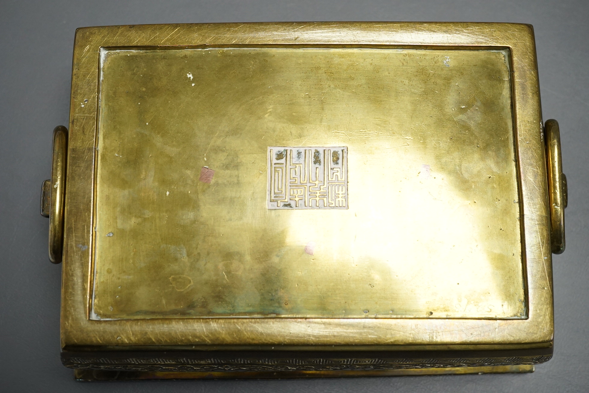 A large Chinese bronze rectangular censer and cover, Xuande seal mark, and a ‘plum blossom and chilong’ bronze censer, both 19th century